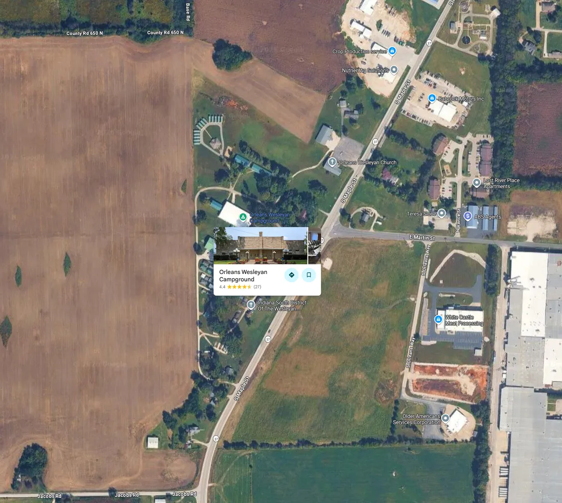 Satellite view of the campground on South Maple Street in Orleans, with the Orleans Wesleyan Campground pin beside the cornfield and State Road 37 to the east